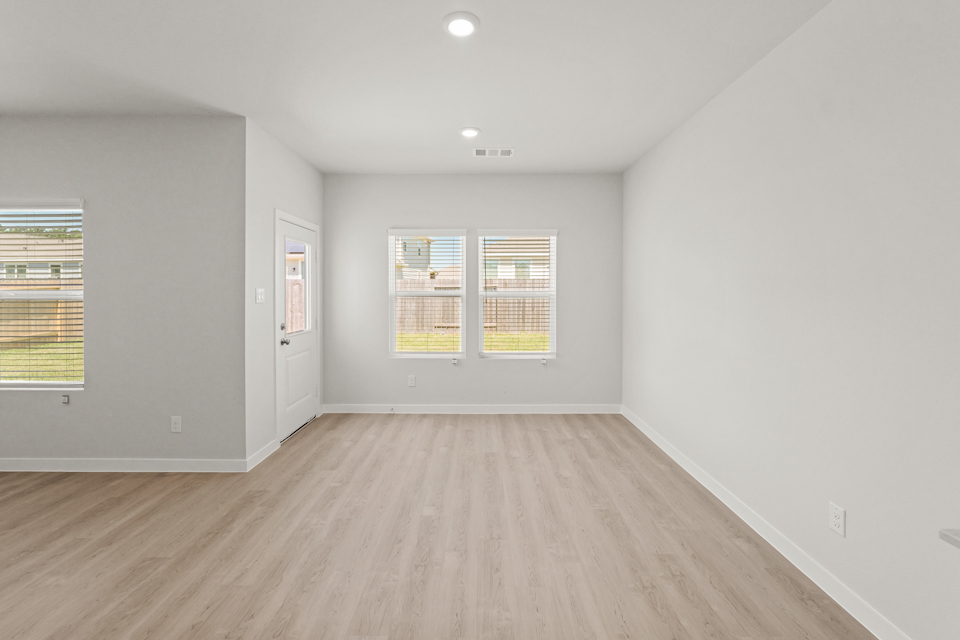 A room with a wood floor and a wood floor.