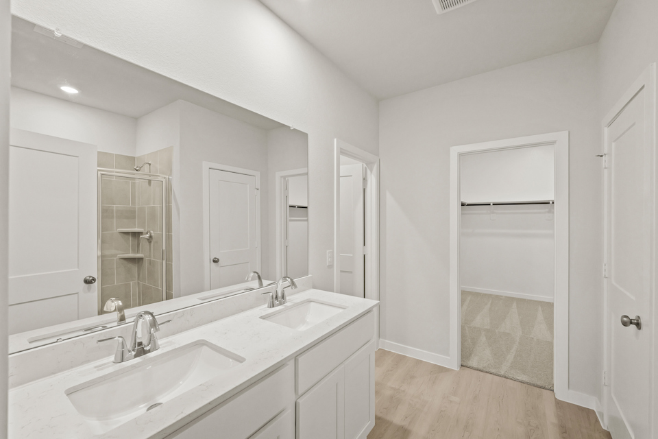 A bathroom with a glass shower.