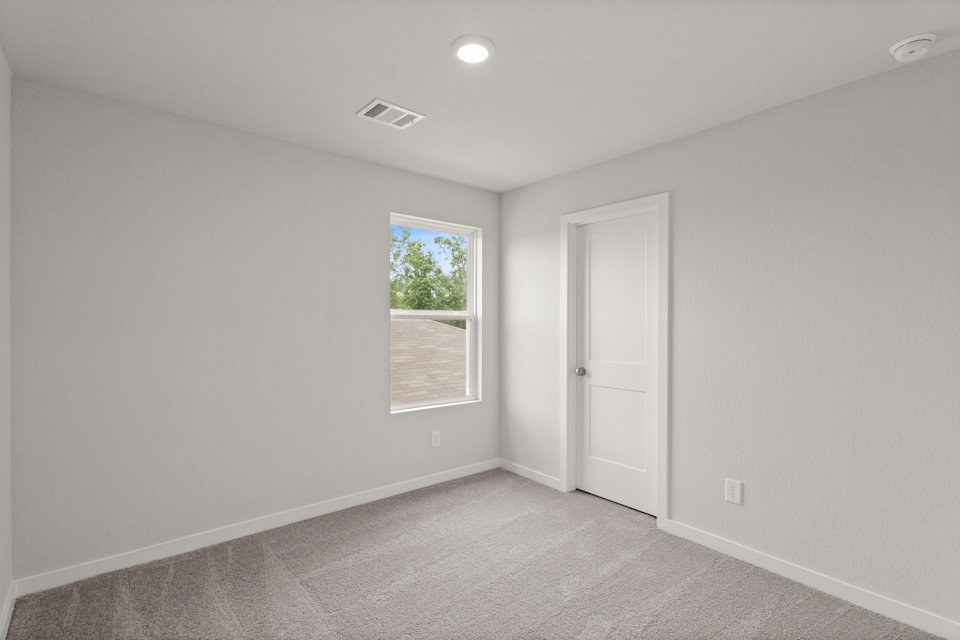 A room with a door and a window.