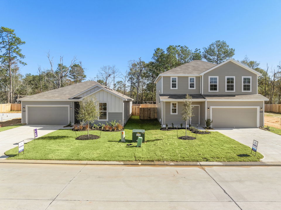 A house with a green lawn.