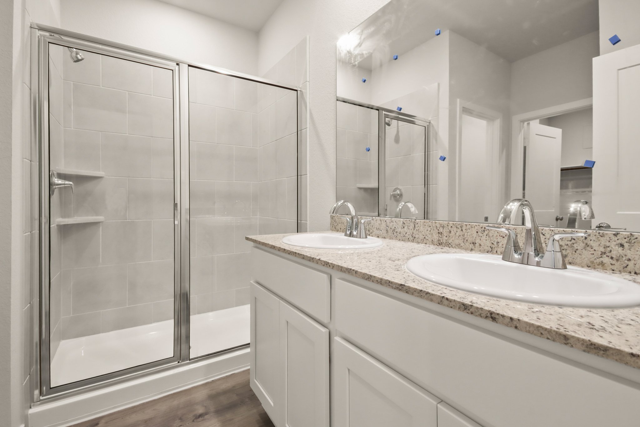 A bathroom with a glass shower.