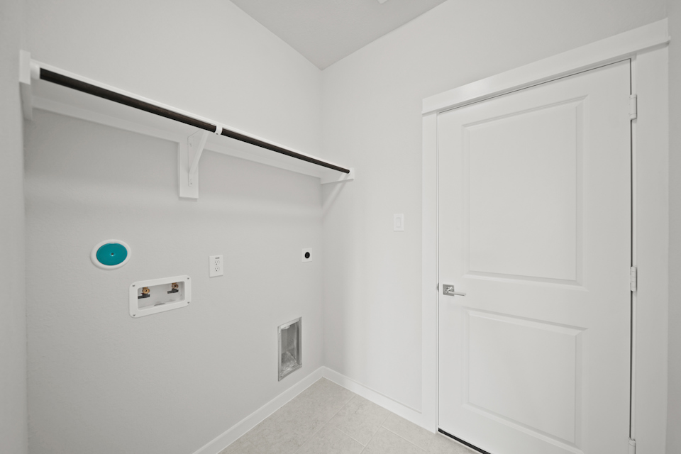 A white door with a blue circle on the wall.