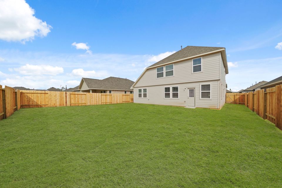 A house with a fence around it.