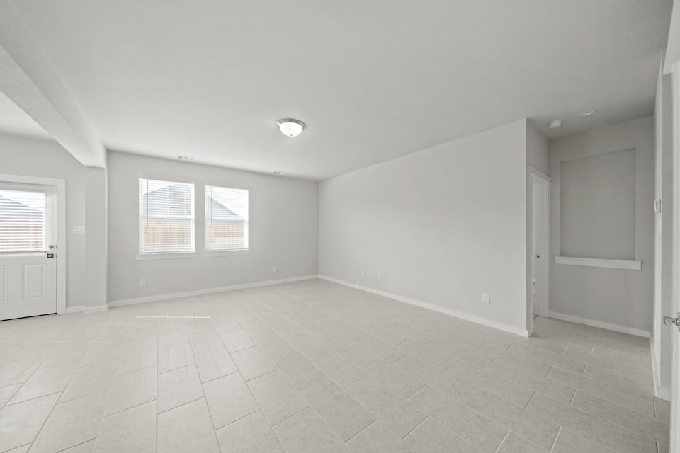 A room with white walls and windows.