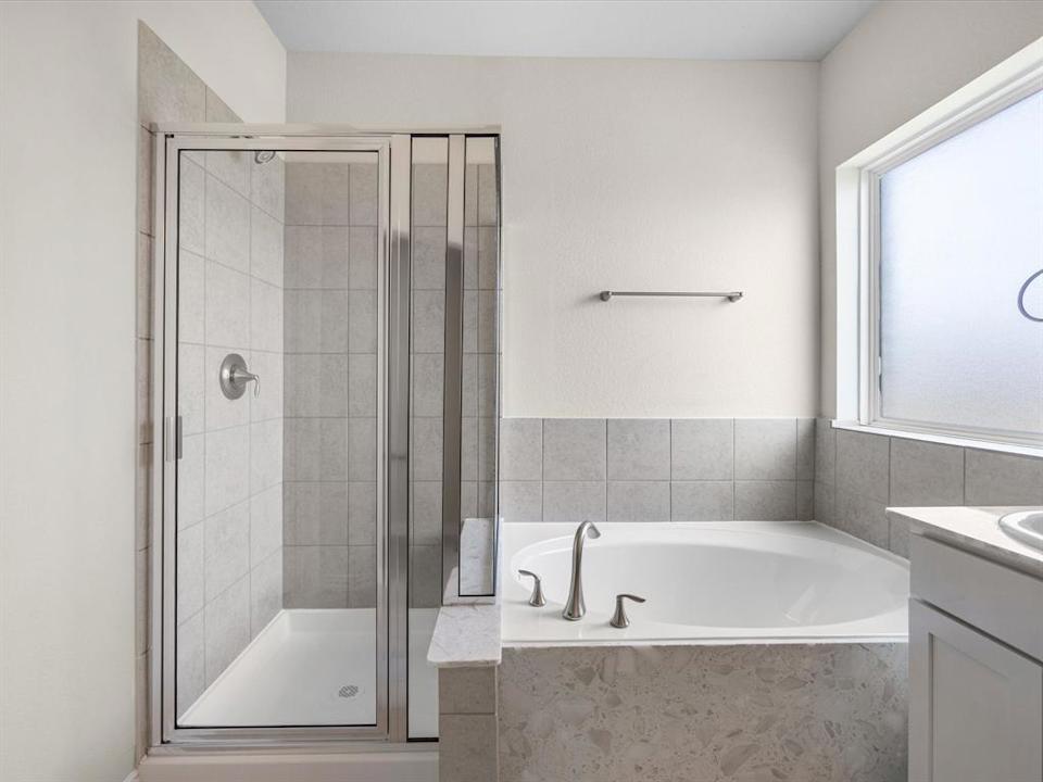 A bathroom with a glass shower.