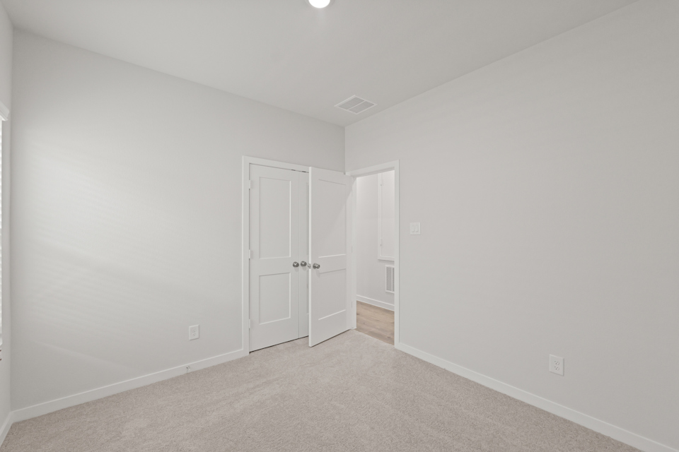 A room with white doors.