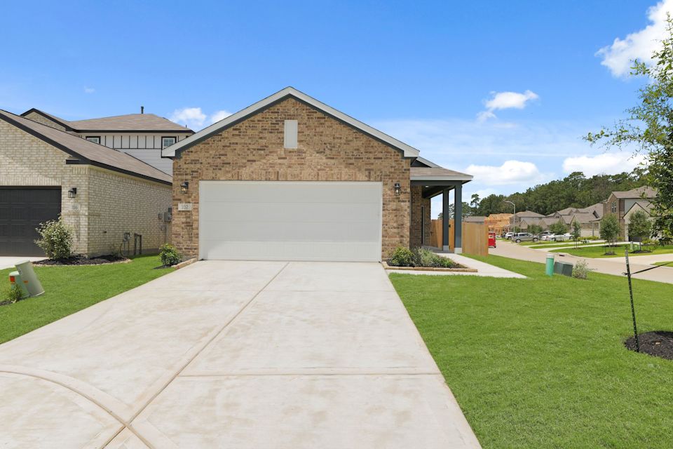 A driveway leading to a house.