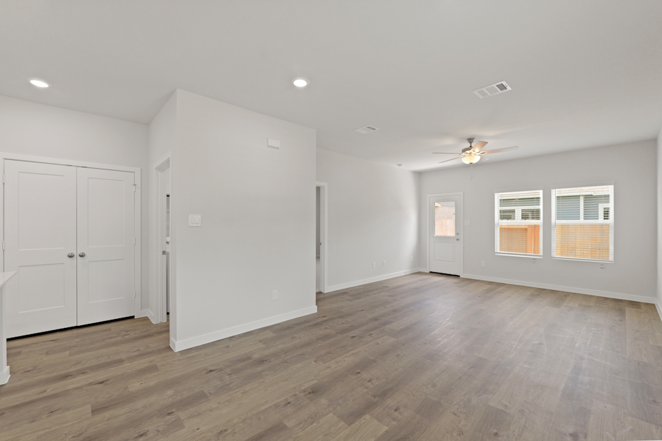 A room with white cabinets.