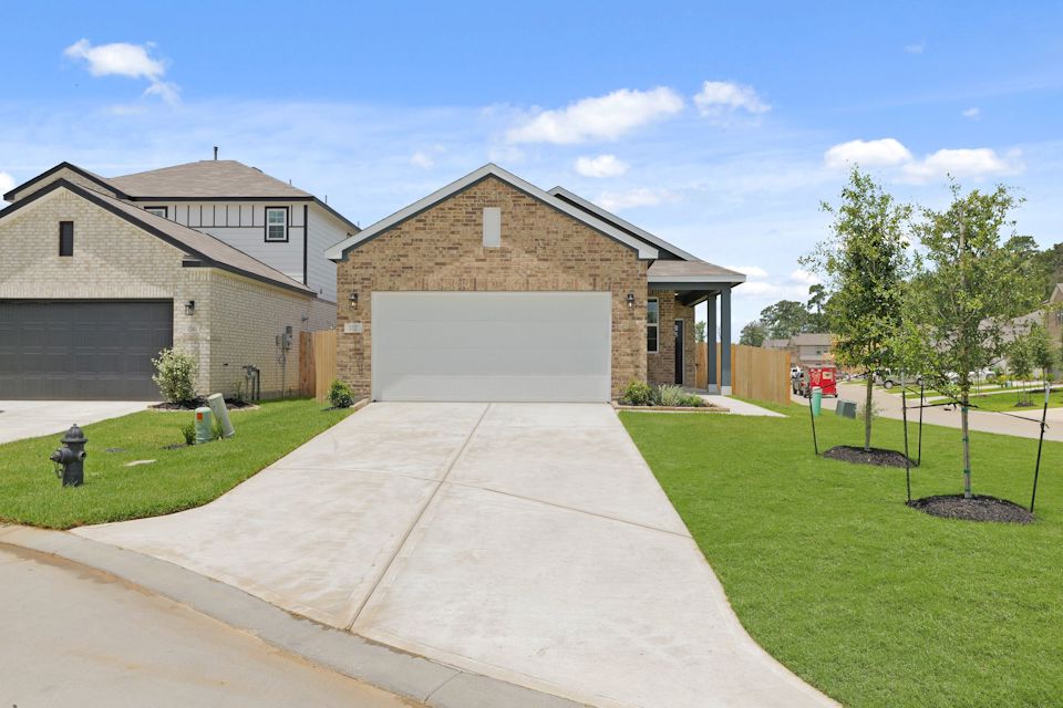 A driveway leading to a house.