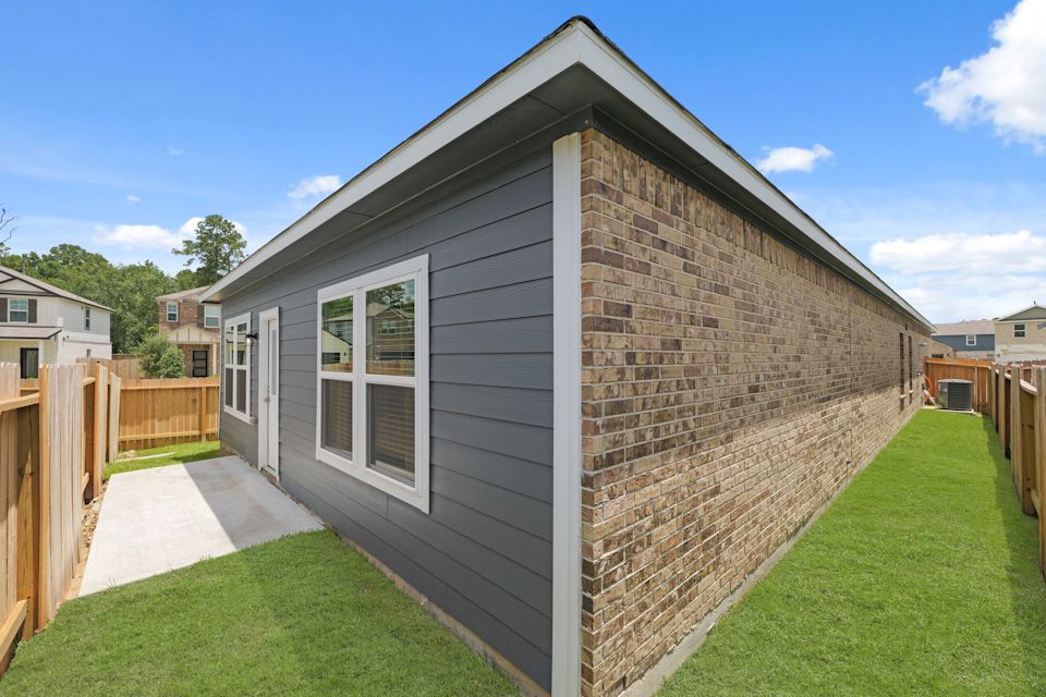 A small house with a fence.