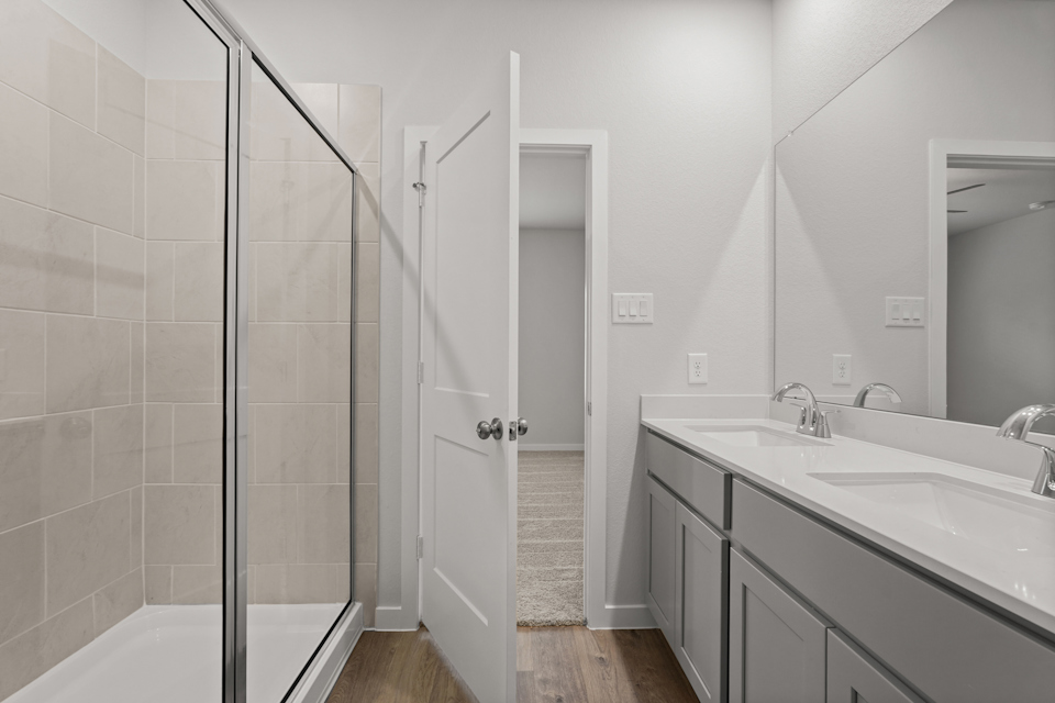 A bathroom with a glass shower.
