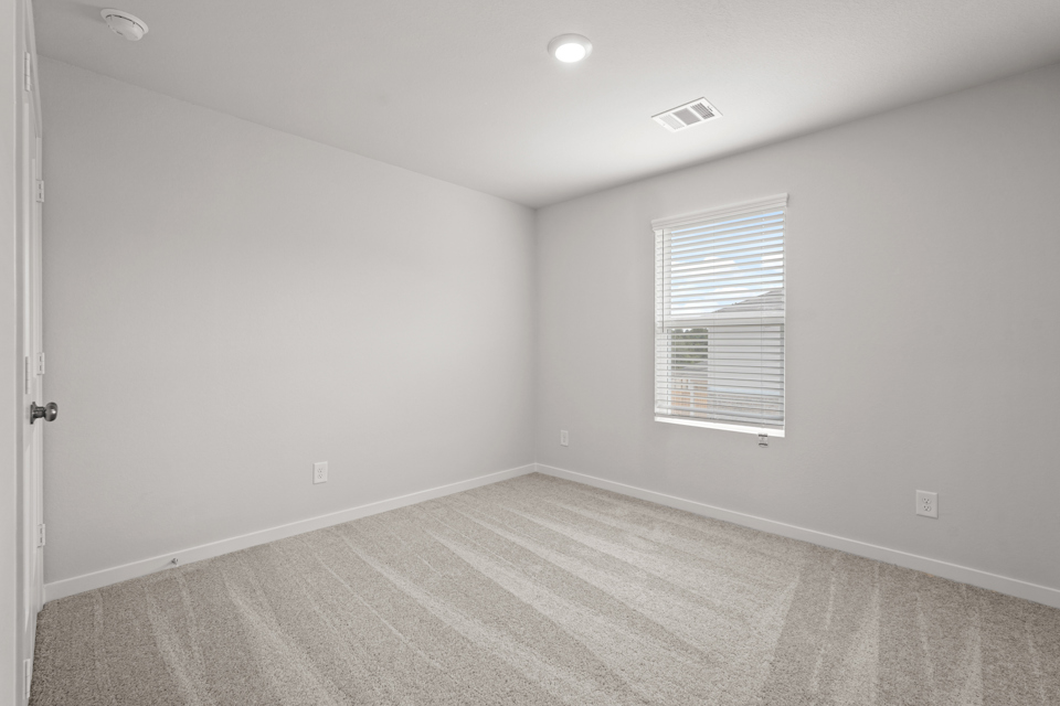 A room with a door and a window.