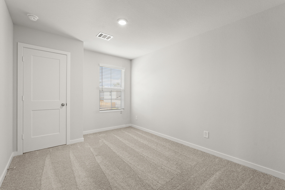 A room with a door and a window.