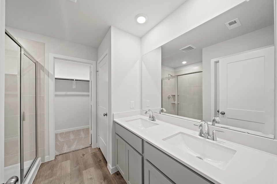A bathroom with a glass shower.