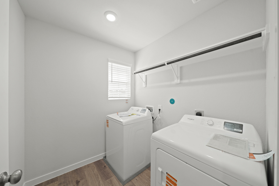 A room with a white wall and a white machine.