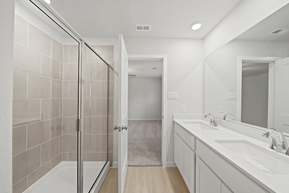 A bathroom with a glass shower.