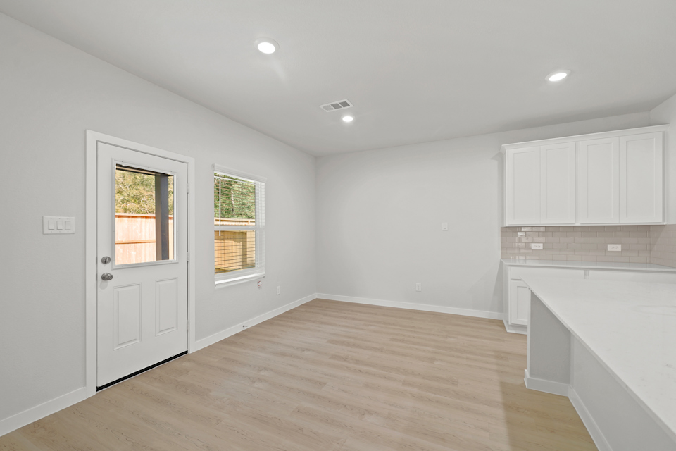 A room with white cabinets.
