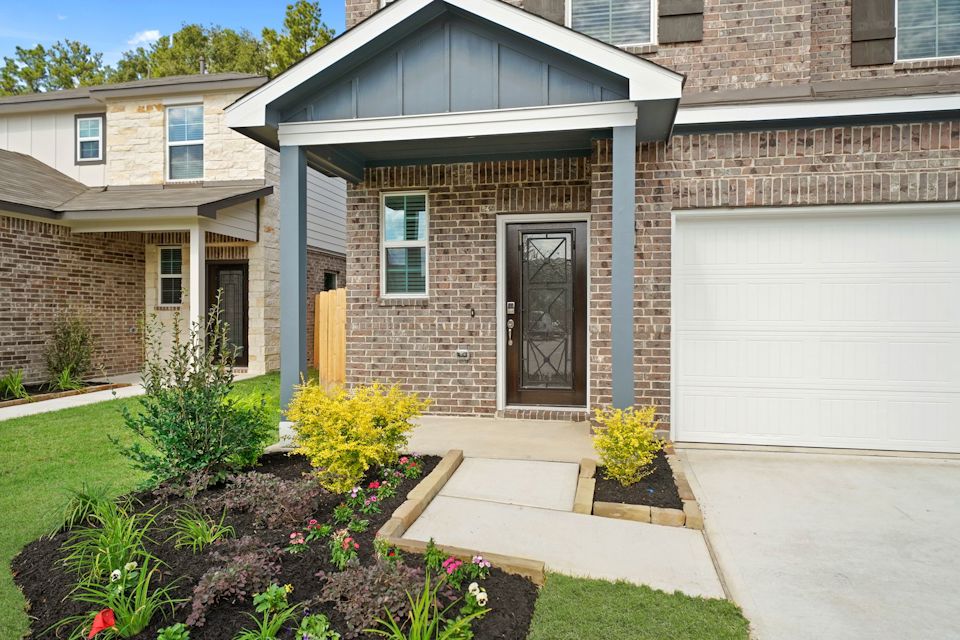 A house with a garage and a driveway.