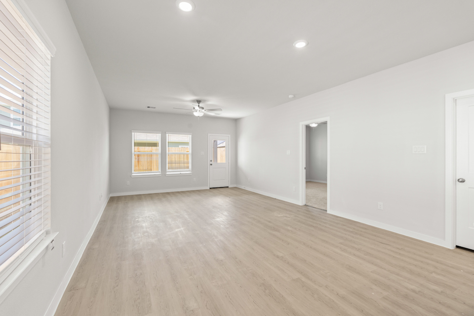 A room with a wood floor and a wood floor.