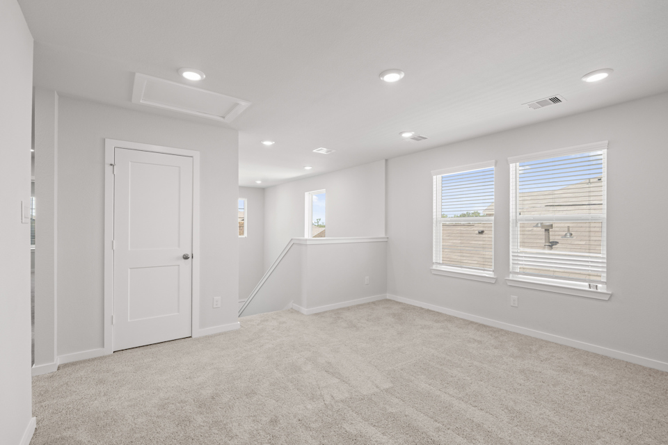 A room with white walls and a white door.