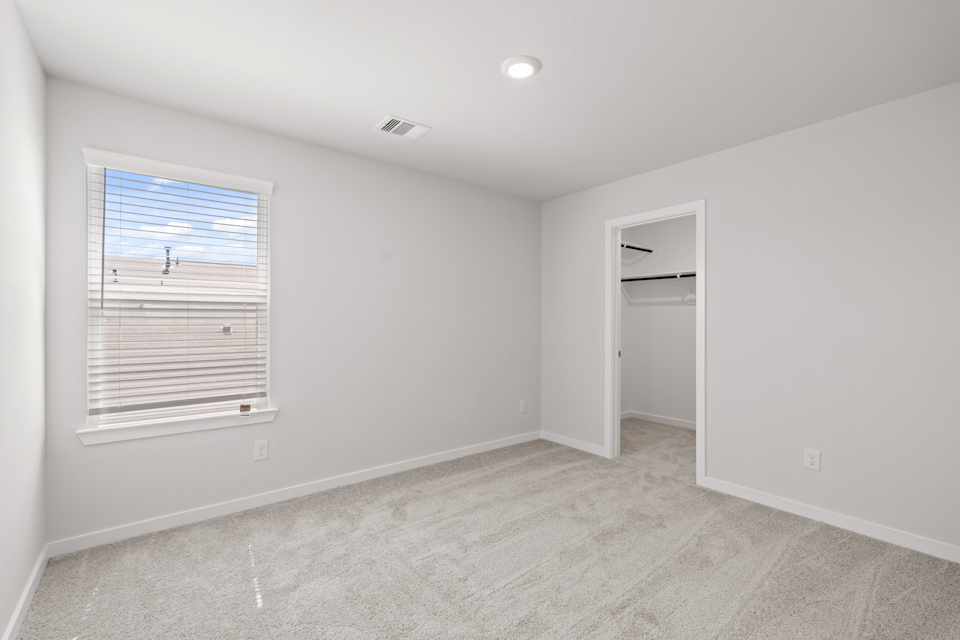 A room with a window and a door.