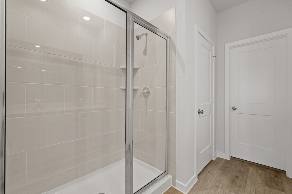 A bathroom with a glass shower.