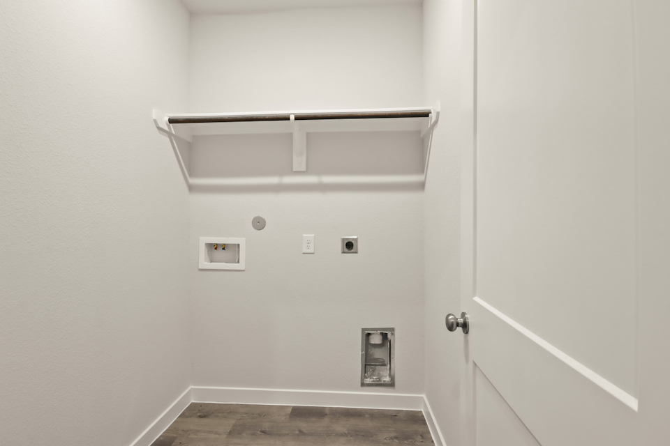 A white door with a light above it.