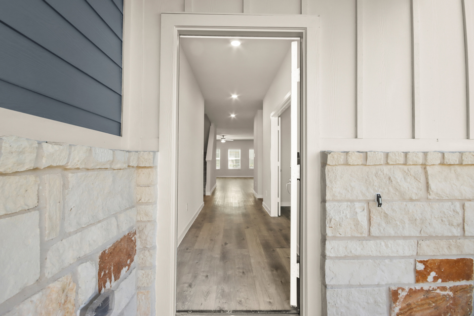 A hallway with white walls.