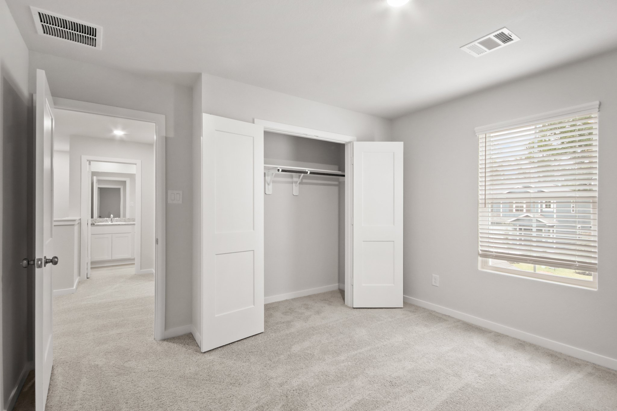 A room with white cabinets.