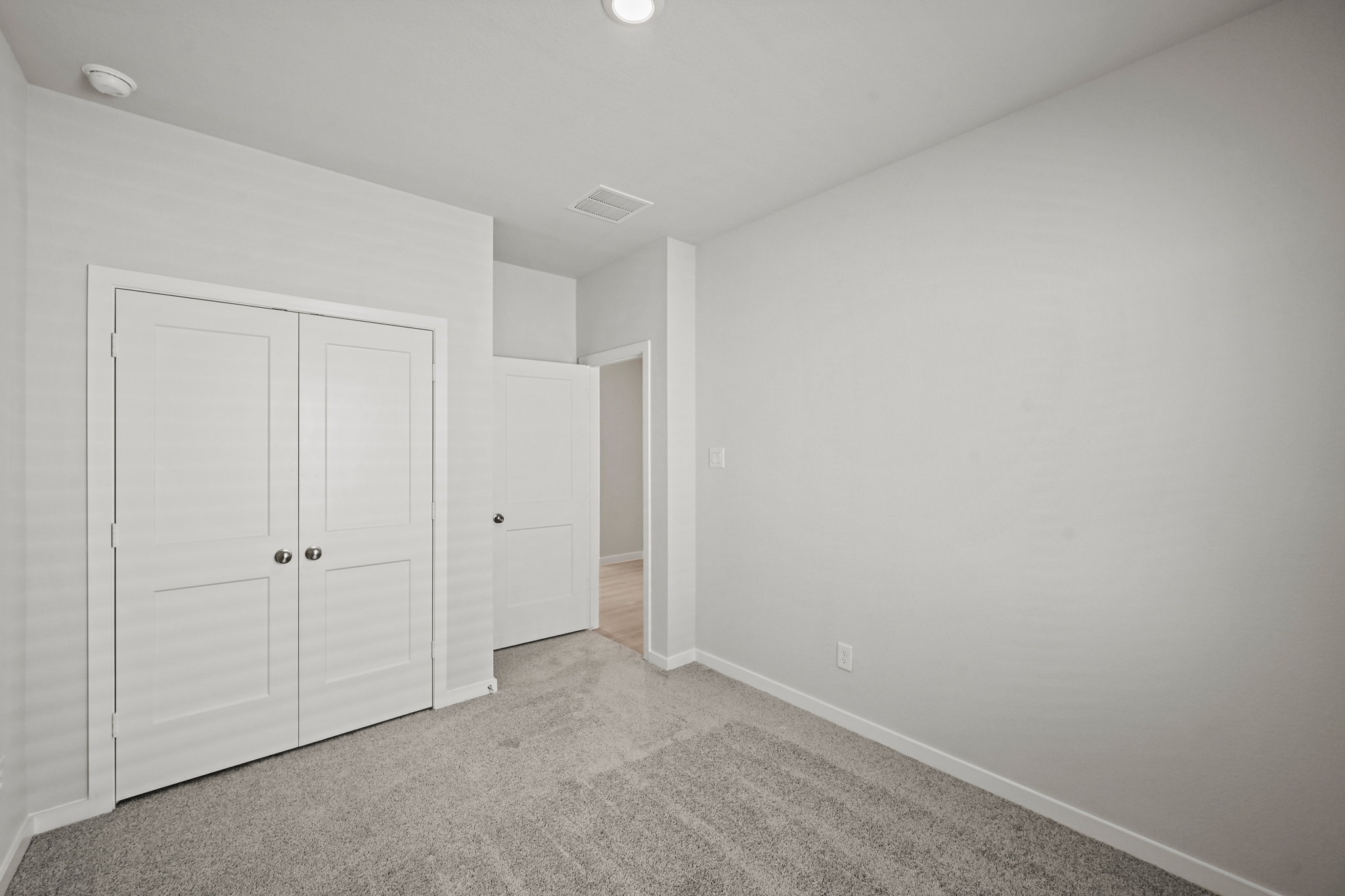 A room with white doors.