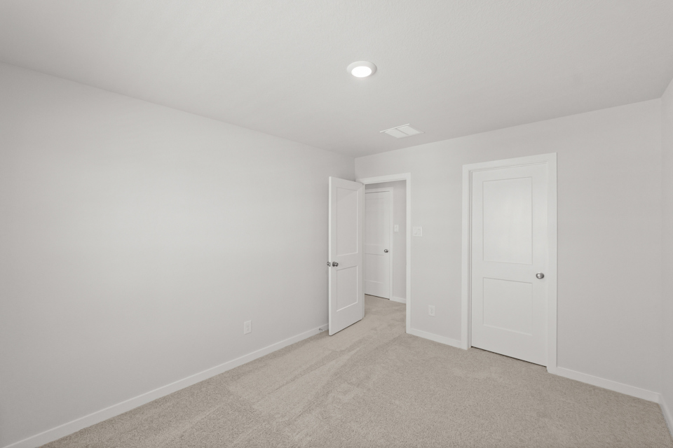 A room with white doors.