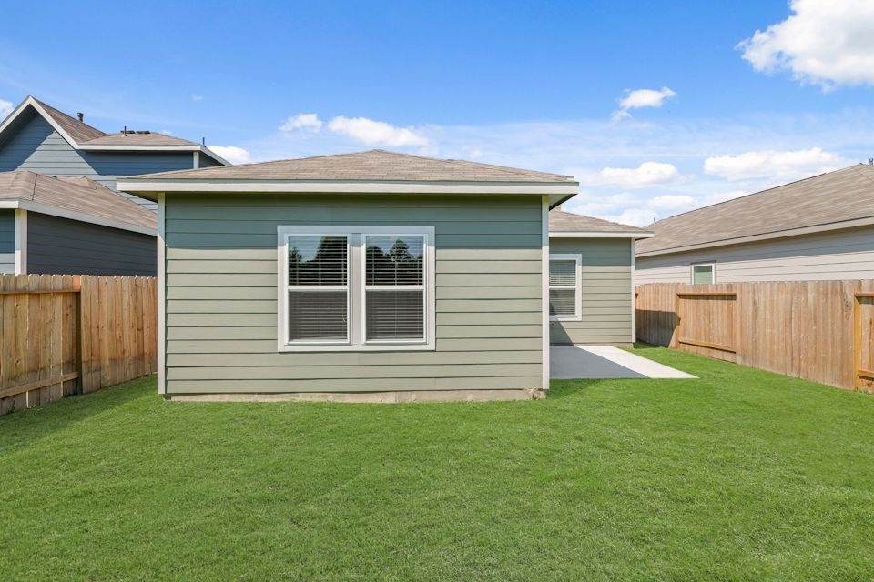 A house with a fence around it.