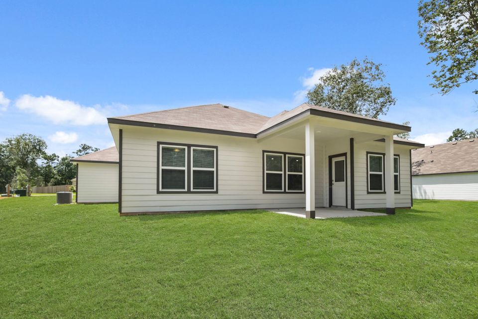 A house with a grass yard.