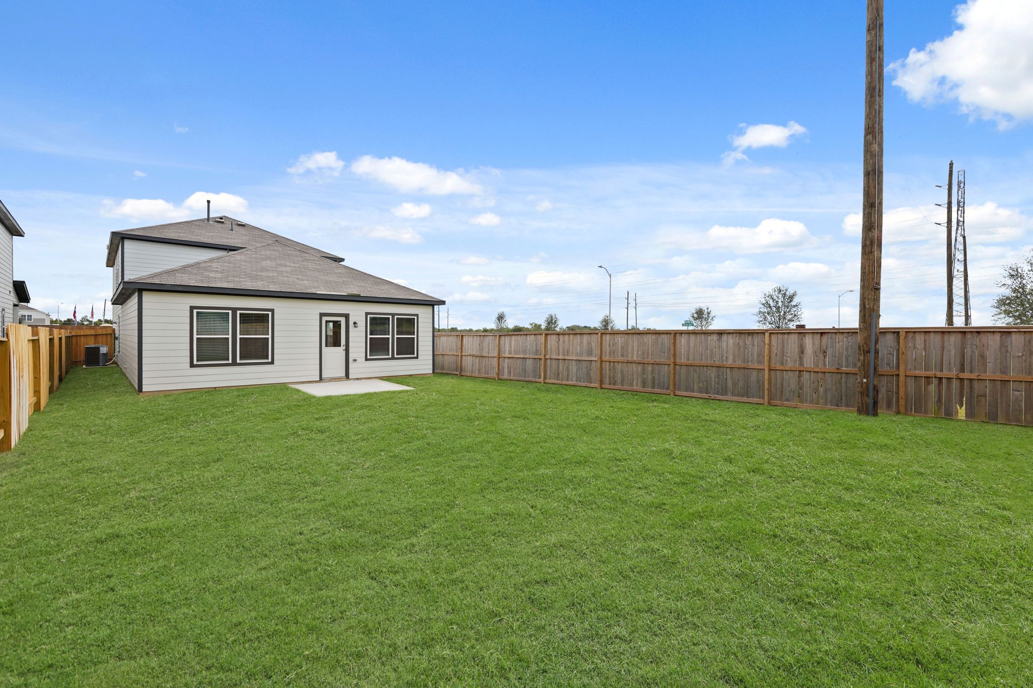 A house in a grassy yard.