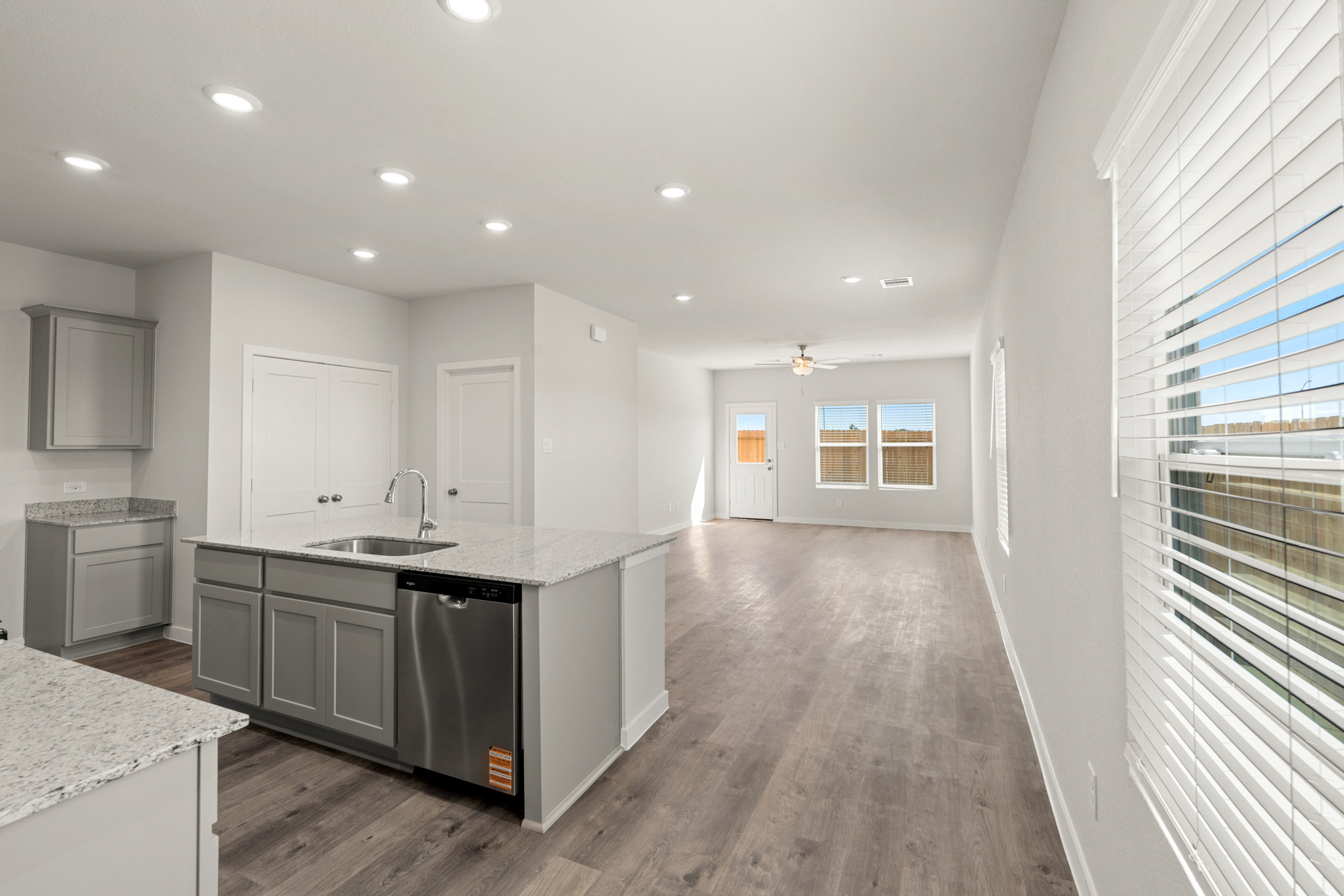 A kitchen with a wood floor.