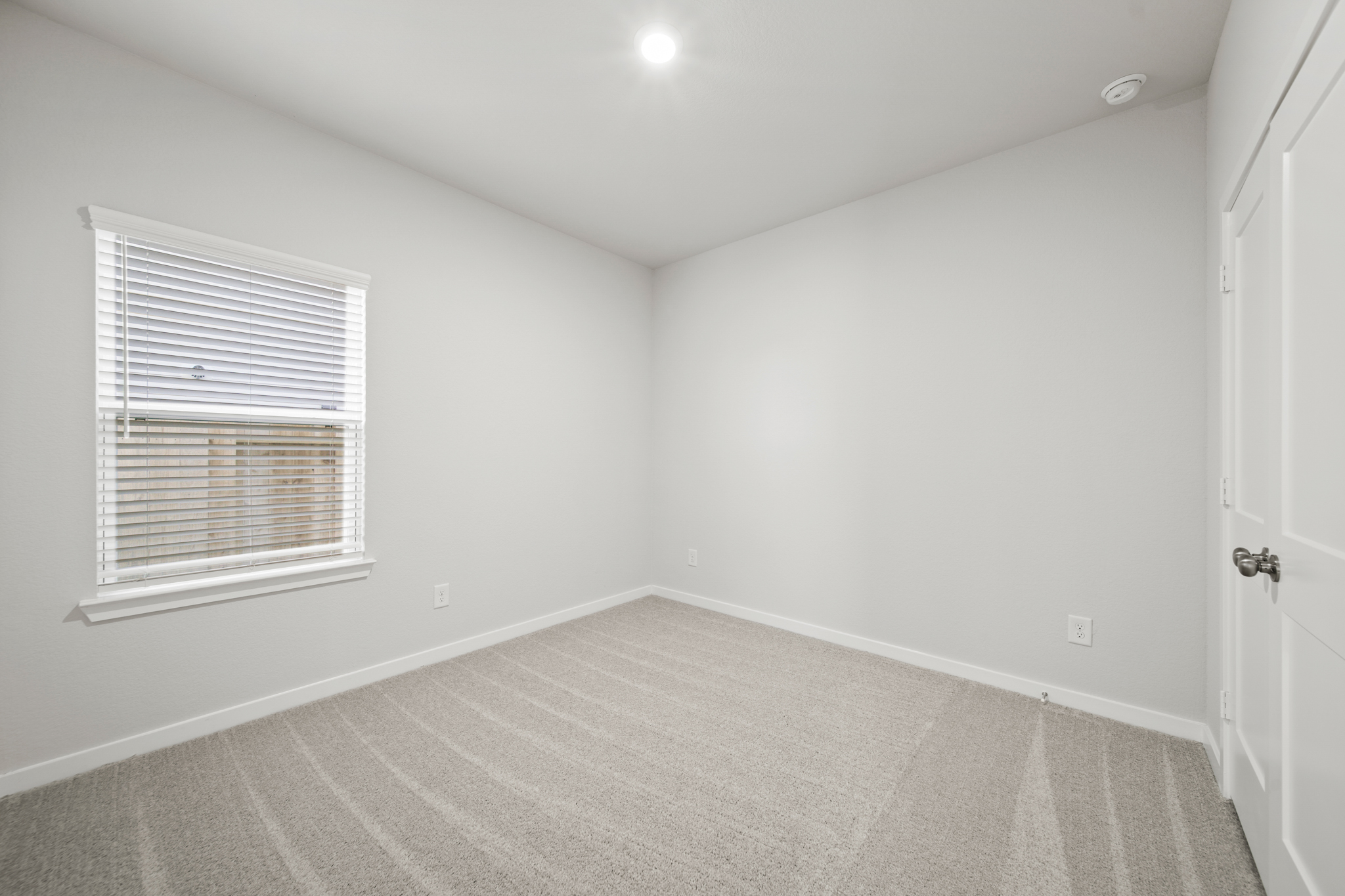 A room with a door and a window.