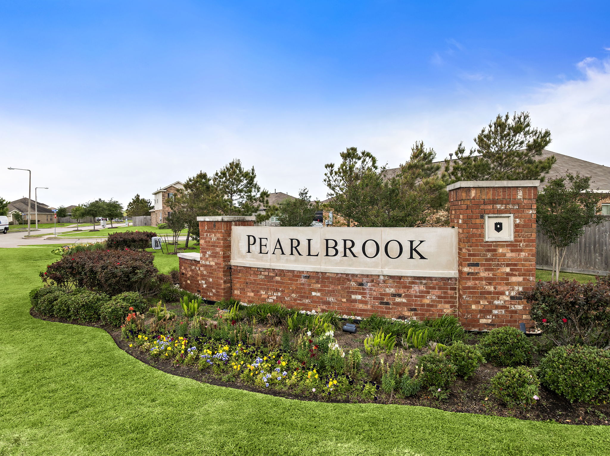 A sign on a brick wall.