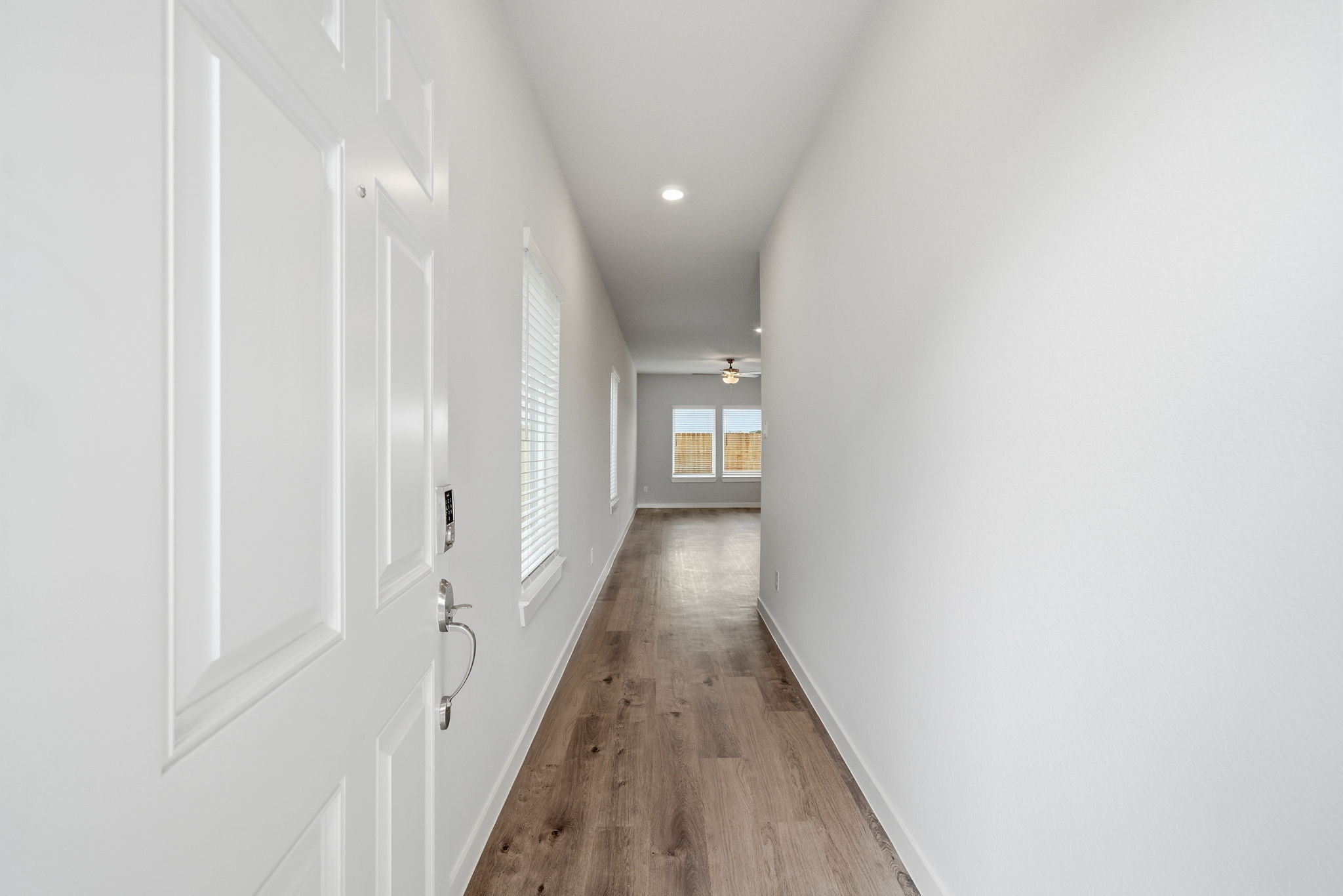 A hallway with white walls.