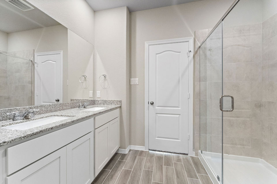 A bathroom with a marble countertop.