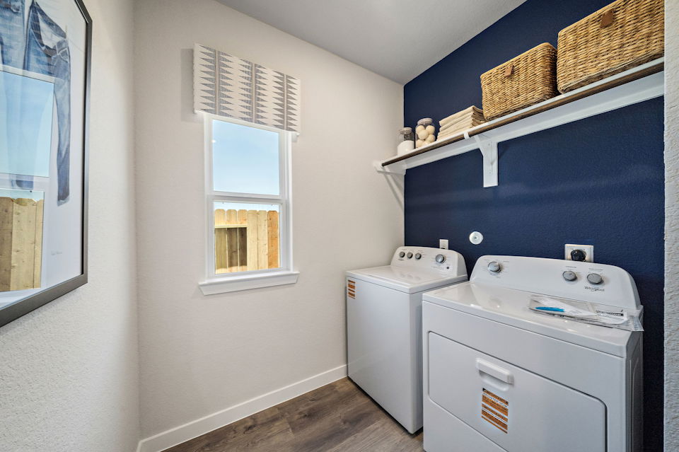 A laundry room with a laundry basket.