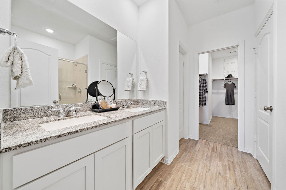 A bathroom with a marble countertop.