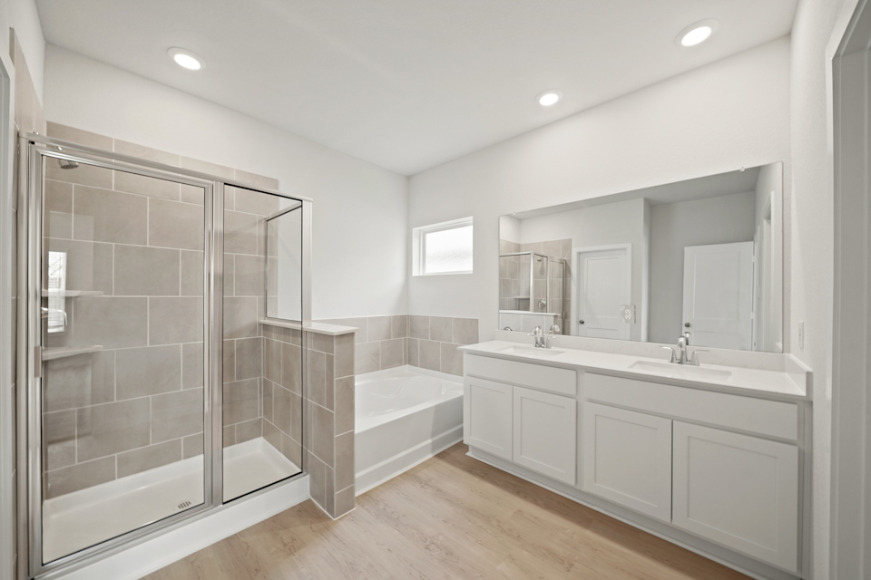 A bathroom with a glass shower.