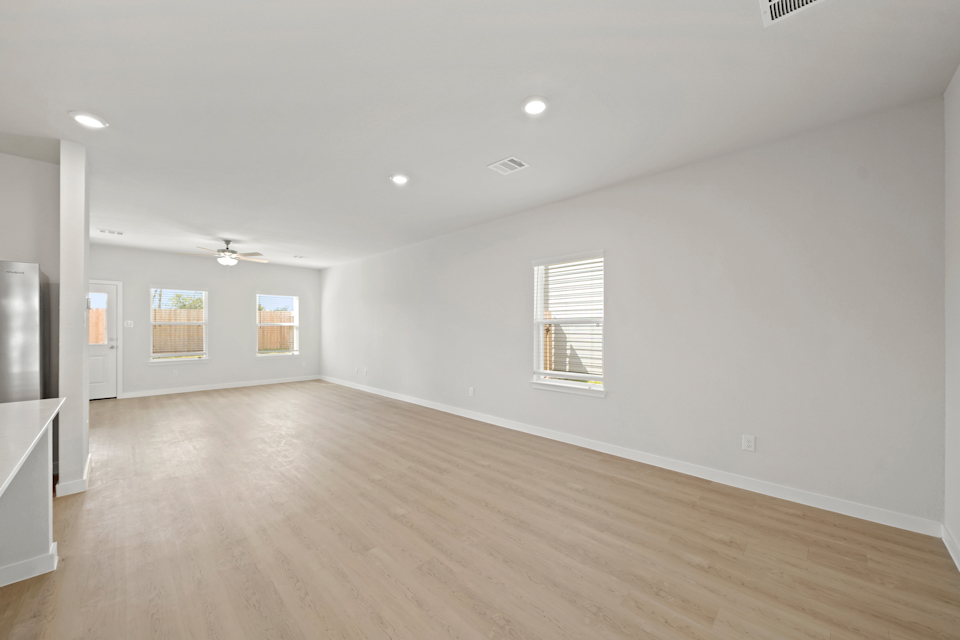 A room with a wood floor and a wood floor.