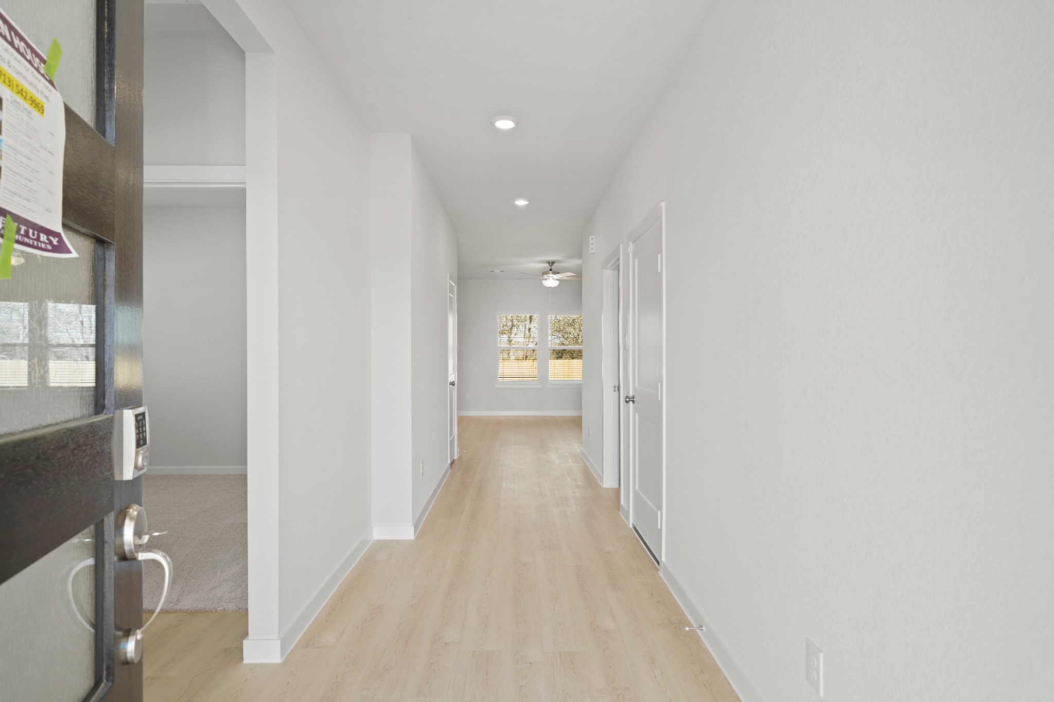 A hallway with white walls.