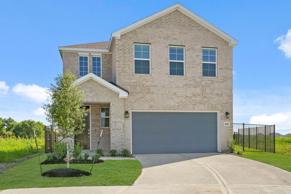 A large house with a driveway.