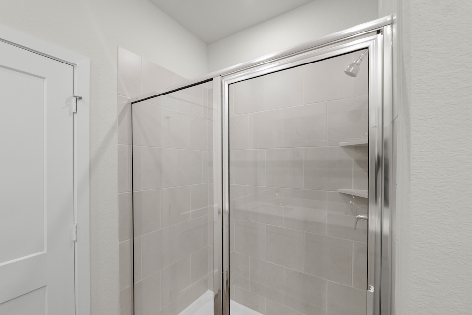 A shower unit in a bathroom.