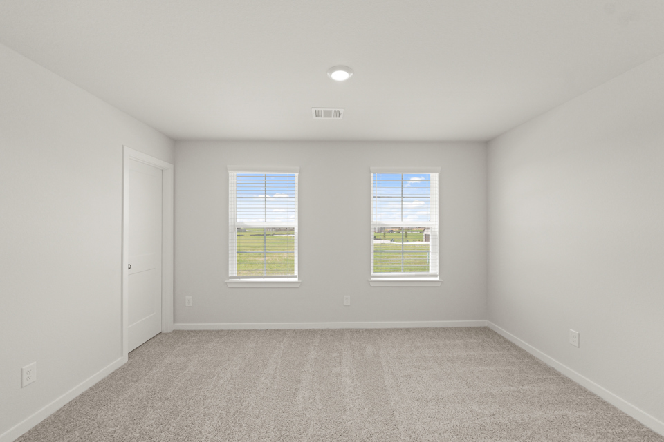 A room with a window and a door.
