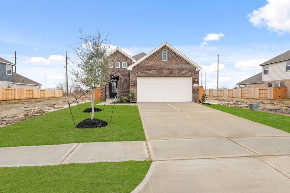 A driveway leading to a house.