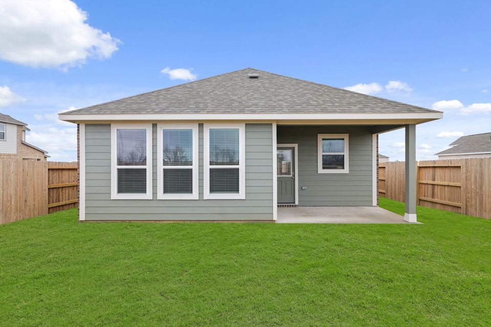 A house with a grass yard.