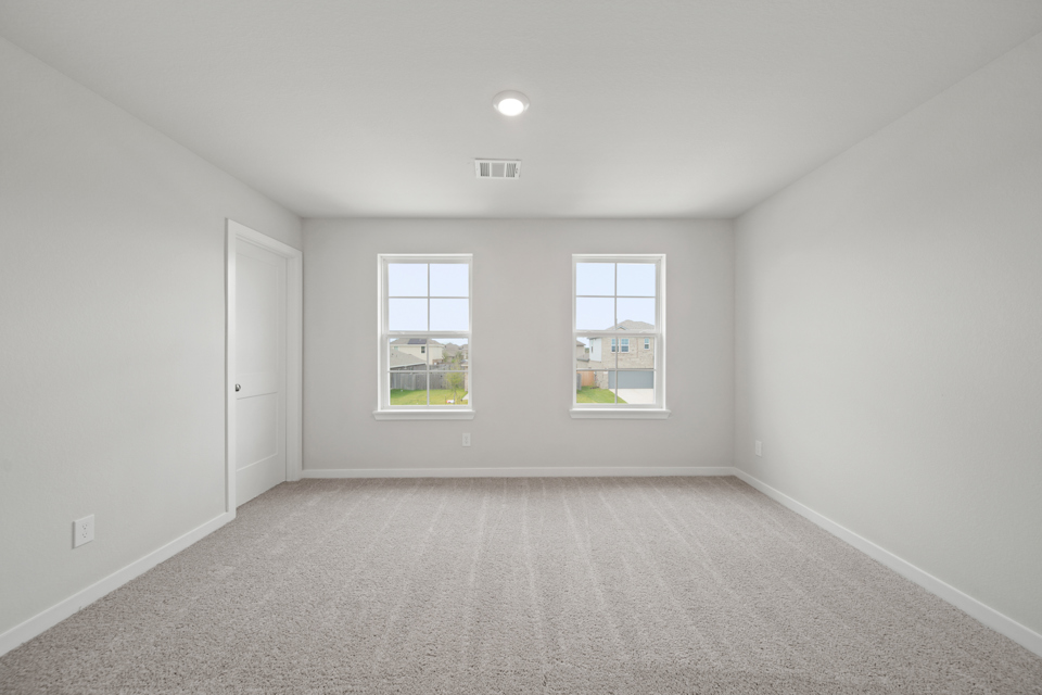A room with a window and a door.